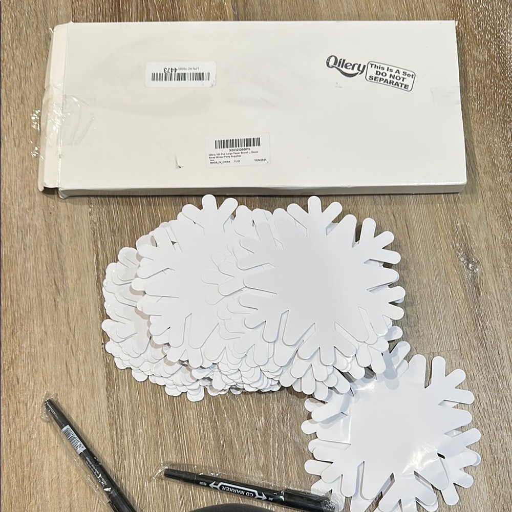 White Snowflake Paper Cutouts 100 piece arts and crafts. Perfect for classrooms
